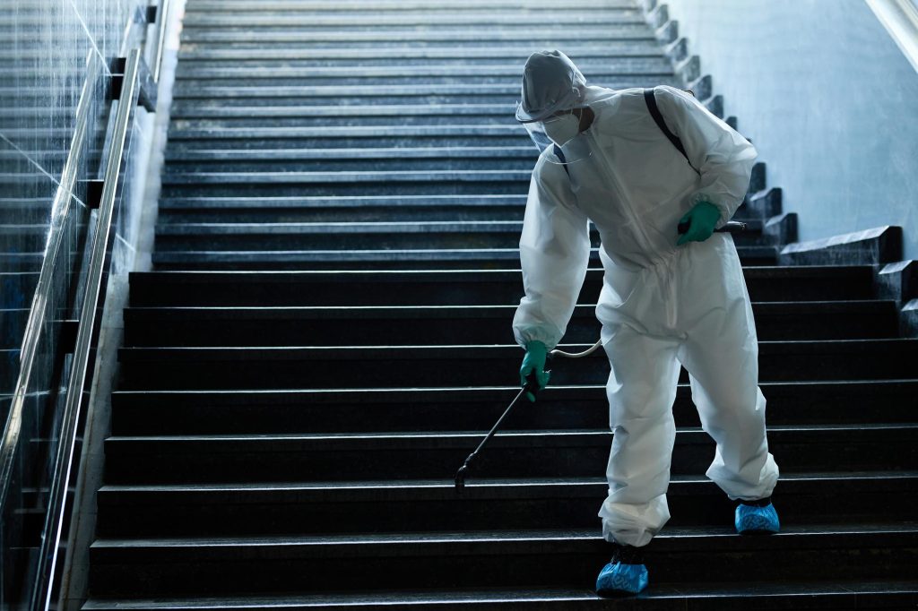 disinfection-worker-spraying-subway-staircase-due-covid19-pandemic